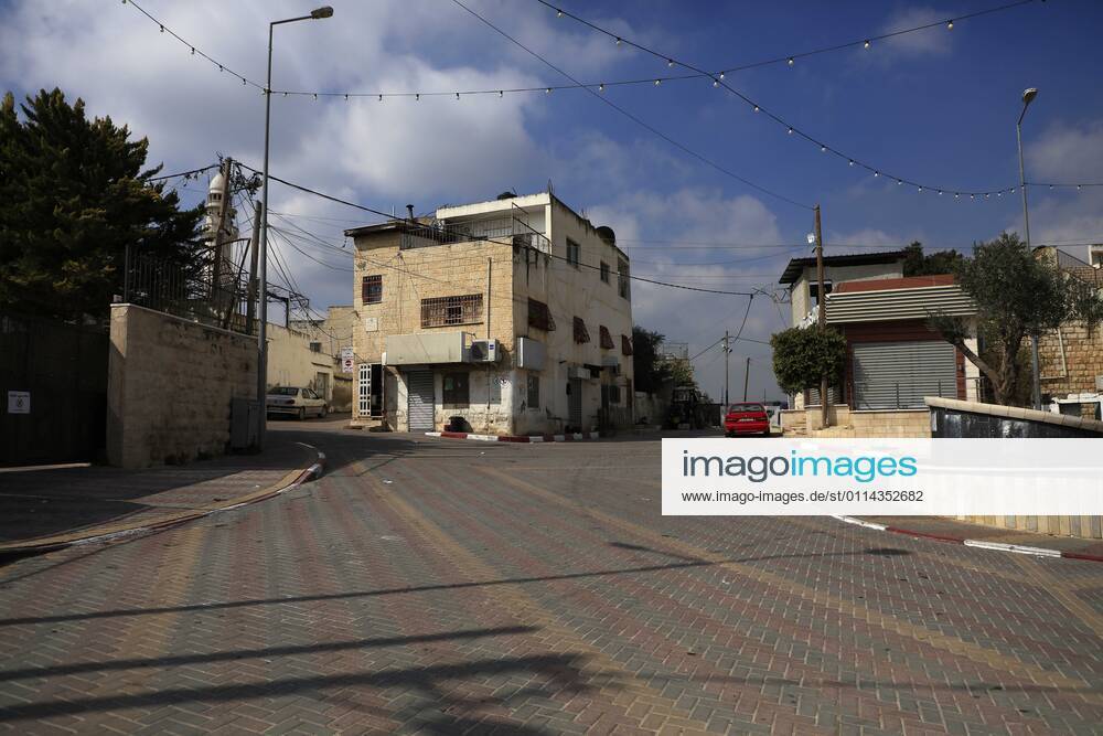 Jenin, West Bank, Palestinian Territory: A deserted street is pictured during a complete closure, amid the coronavirus lockdown in the town of Zababdeh, south of Jenin, in the West Bank on February 28, 2021. Prime Minister Mohammad Shtayyeh announced a new set of restrictions in response to a recent surge in coronavirus infections, including of British and South African mutants, in Palestine.A lockdown of all public and private schools for all classes, except for high school students for a period of 12 days, including kindergartens..A lockdown of all universities, educational and vocational institutes and shifting to distance e-learning programs. A maximum of 50 percent of administrative staff are allowed access to univer - ZUMAap3_ 20210228_zaf_ap3_040