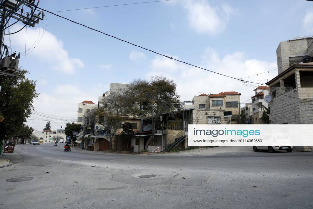 Jenin, West Bank, Palestinian Territory: A deserted street is pictured during a complete closure, amid the coronavirus lockdown in the town of Zababdeh, south of Jenin, in the West Bank on February 28, 2021. Prime Minister Mohammad Shtayyeh announced a new set of restrictions in response to a recent surge in coronavirus infections, including of British and South African mutants, in Palestine.A lockdown of all public and private schools for all classes, except for high school students for a period of 12 days, including kindergartens..A lockdown of all universities, educational and vocational institutes and shifting to distance e-learning programs. A maximum of 50 percent of administrative staff are allowed access to univer - ZUMAap3_ 20210228_zaf_ap3_041