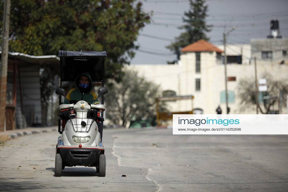 Jenin, West Bank, Palestinian Territory: A man walks on an empty street, amid the coronavirus lockdown in the town of Zababdeh, south of Jenin, in the West Bank on February 28, 2021. Prime Minister Mohammad Shtayyeh announced a new set of restrictions in response to a recent surge in coronavirus infections, including of British and South African mutants, in Palestine.A lockdown of all public and private schools for all classes, except for high school students for a period of 12 days, including kindergartens..A lockdown of all universities, educational and vocational institutes and shifting to distance e-learning programs. A maximum of 50 percent of administrative staff are allowed access to universities..Movement between - ZUMAap3_ 20210228_zaf_ap3_042