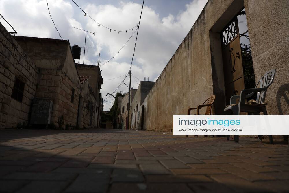 Jenin, West Bank, Palestinian Territory: A deserted street is pictured during a complete closure, amid the coronavirus lockdown in the town of Zababdeh, south of Jenin, in the West Bank on February 28, 2021. Prime Minister Mohammad Shtayyeh announced a new set of restrictions in response to a recent surge in coronavirus infections, including of British and South African mutants, in Palestine.A lockdown of all public and private schools for all classes, except for high school students for a period of 12 days, including kindergartens..A lockdown of all universities, educational and vocational institutes and shifting to distance e-learning programs. A maximum of 50 percent of administrative staff are allowed access to univer - ZUMAap3_ 20210228_zaf_ap3_050