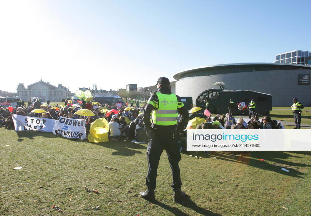 Dutch anti-riot police enclose anti-lockdown supporters during illegal demonstration against the coronavirus measures at the Museumplein on February 28, 2021 in Amsterdam,Netherlands. Amsterdam Mayor Femke Halsema classified the Museumplein as security risk area , giving police officers the right to check and search anybody in that area to prevent illegal demonstration and vandalism. Amsterdam Netherlands
