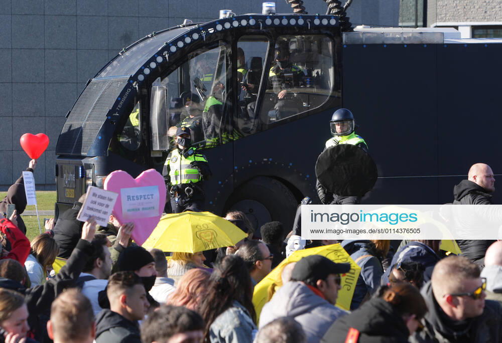 Dutch anti-riot police enclose anti-lockdown supporters during illegal demonstration against the coronavirus measures at the Museumplein on February 28, 2021 in Amsterdam,Netherlands. Amsterdam Mayor Femke Halsema classified the Museumplein as security risk area , giving police officers the right to check and search anybody in that area to prevent illegal demonstration and vandalism. Amsterdam Netherlands