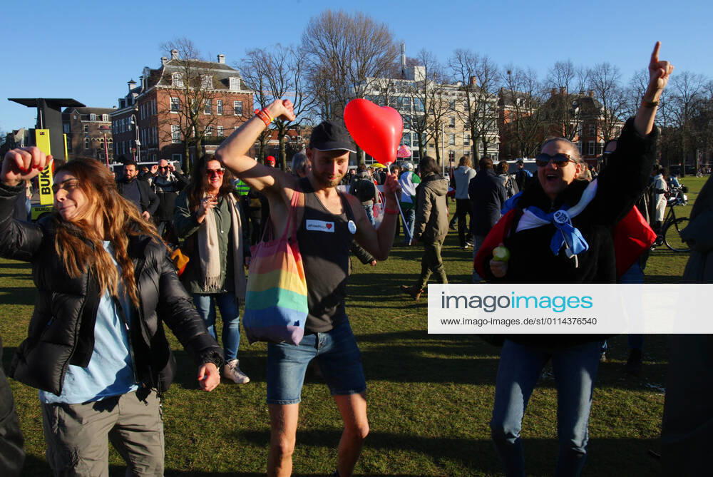 Anti-Lockdown supporters take part during illegal demonstration against the coronavirus measures at the Museumplein on February 28, 2021 in Amsterdam,Netherlands. Amsterdam Mayor Femke Halsema classified the Museumplein as security risk area , giving police officers the right to check and search anybody in that area to prevent illegal demonstration and vandalism. Amsterdam Netherlands
