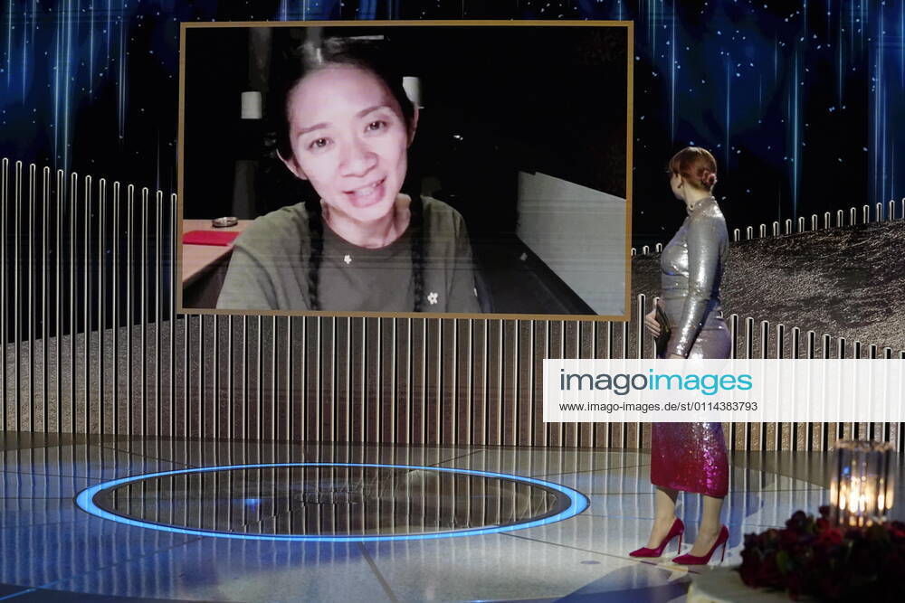 (l-r) Chloà Zhao accepts the Best Director - Motion Picture award for ˜Nomadland via video; Bryce Dallas Howard onstage at the 78th Annual Golden Globe Awards held at the Rainbow Room. New York USA - ZUMA40.J 20210228_mda_z03_336
