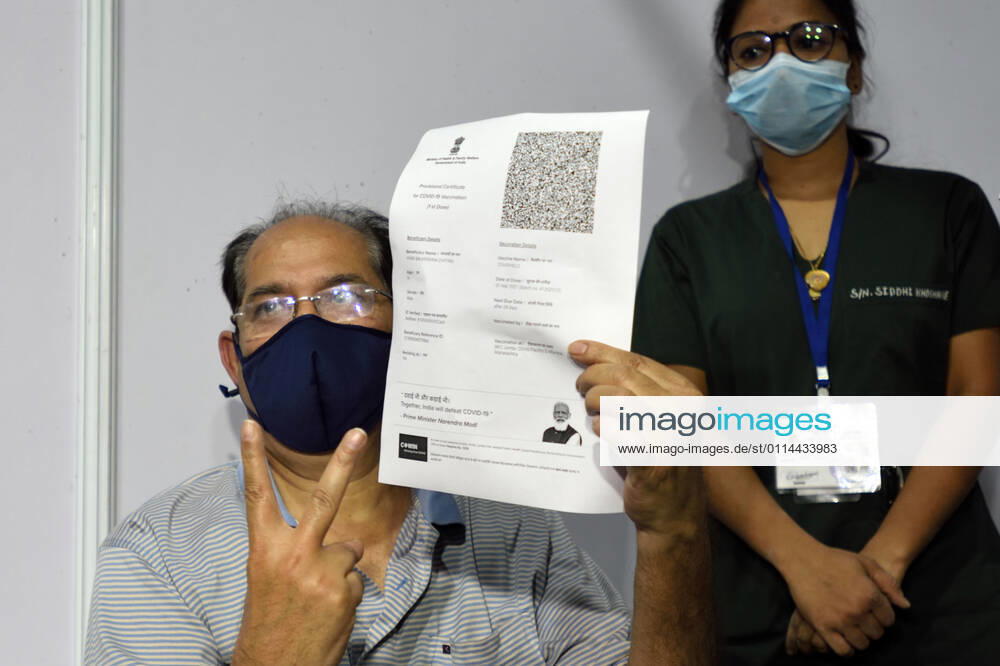 A senior citizen holding up a registration slip during inoculation to get their first dose of a Covid-19 vaccine, at BKC on March 1, 2021 in Mumbai, India. India?s Covid-19 vaccination drive was extended today to include the elderly and those with co-morbidities. (Photo by Satish Bate Hindustan Times) Covid Vaccination Phase 2 Starts In India