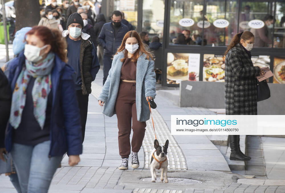 People wearing face masks walk on a street in Ankara, Turkey, on march 2, 2021. Turkey has confirmed 28,706 deaths and 2,723,316 positive cases of the coronavirus infection in the country. (Abdurrahman Antakyali Depo Photos)