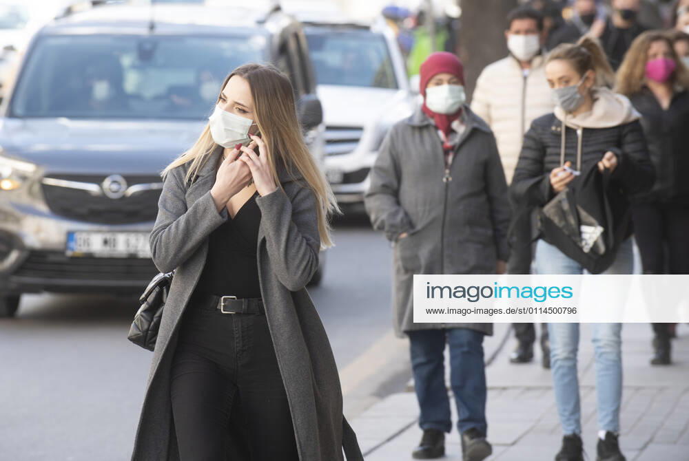 People wearing face masks walk on a street in Ankara, Turkey, on march 2, 2021. Turkey has confirmed 28,706 deaths and 2,723,316 positive cases of the coronavirus infection in the country. (Abdurrahman Antakyali Depo Photos)