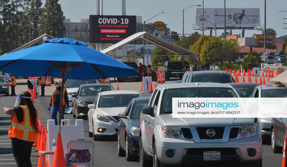 Drivers remain in their vehicles while being monitored to ensure they suffer no adverse reaction to the COVID-19 Moderna vaccine they received at the Forum in Inglewood, California on Saturday, March 6, 2021. As more Californians get vaccinated, the state will make it easier for counties to reopen, Newsom administration officials announced this week. Once 2 million coronavirus vaccines have been given to people in the state s most disadvantaged ZIP codes, the California Department of Public Health will lower the threshold for counties to move from the most restrictive purple tier into the less restrictive red tier. LAP2021030615 JIMxRUYMEN