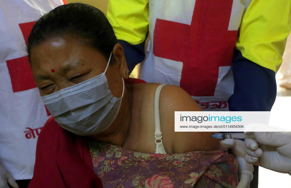 An elderly woman receives a dose of Covishield COVID-19 vaccine at a hospital in Kathmandu,Nepal on March 8, 2021. Nepal started the nationwide campaign to inoculate the elderly population,over 65 years with with Covishield,the Oxford-AstraZeneca vaccine. Kathmandu Nepal - ZUMAs233 20210308_zap_s233_004