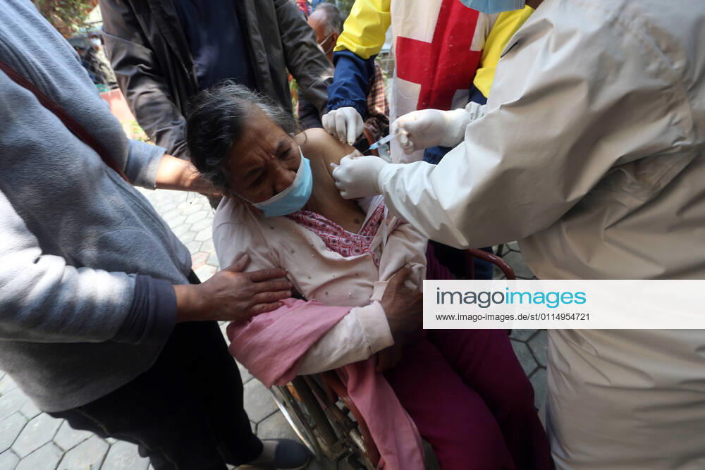 An elderly woman receives a dose of Covishield COVID-19 vaccine at a hospital in Kathmandu,Nepal on March 8, 2021. Nepal started the nationwide campaign to inoculate the elderly population,over 65 years with with Covishield,the Oxford-AstraZeneca vaccine. Kathmandu Nepal - ZUMAs233 20210308_zap_s233_005