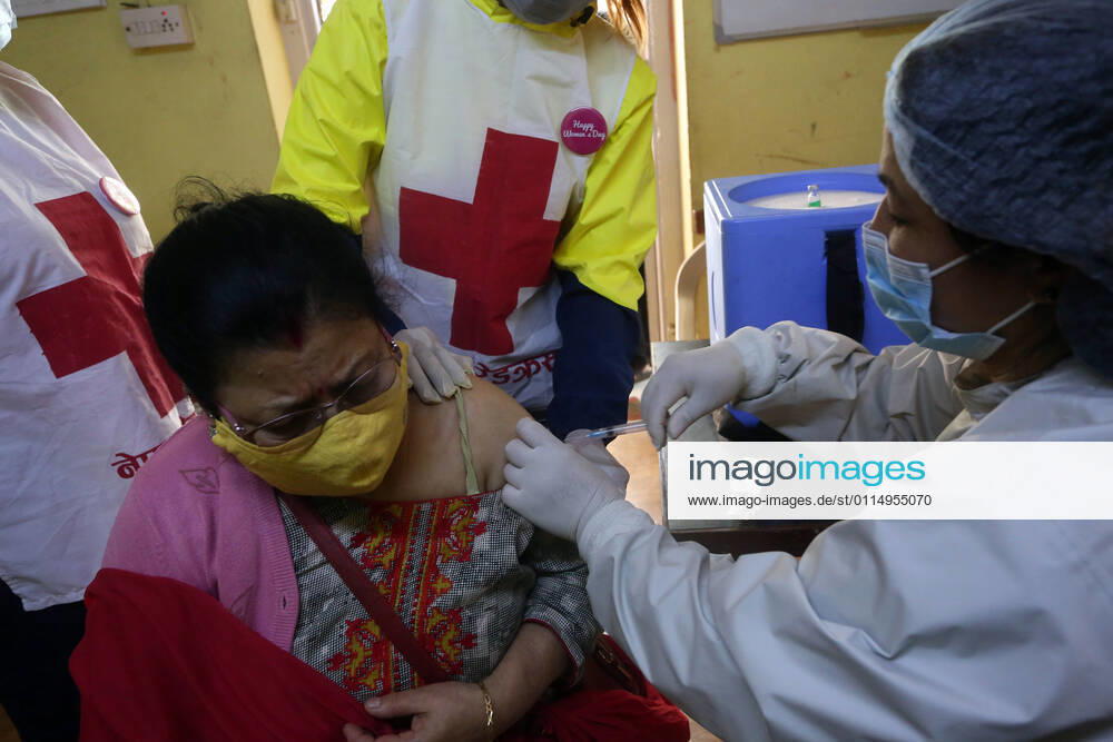 A female health worker gives a dose of Covishield COVID-19 vaccine to an elderly woman on International Women s Day at a hospital in Kathmandu,Nepal on March 8, 2021. Kathmandu Nepal - ZUMAs233 20210308_zap_s233_008