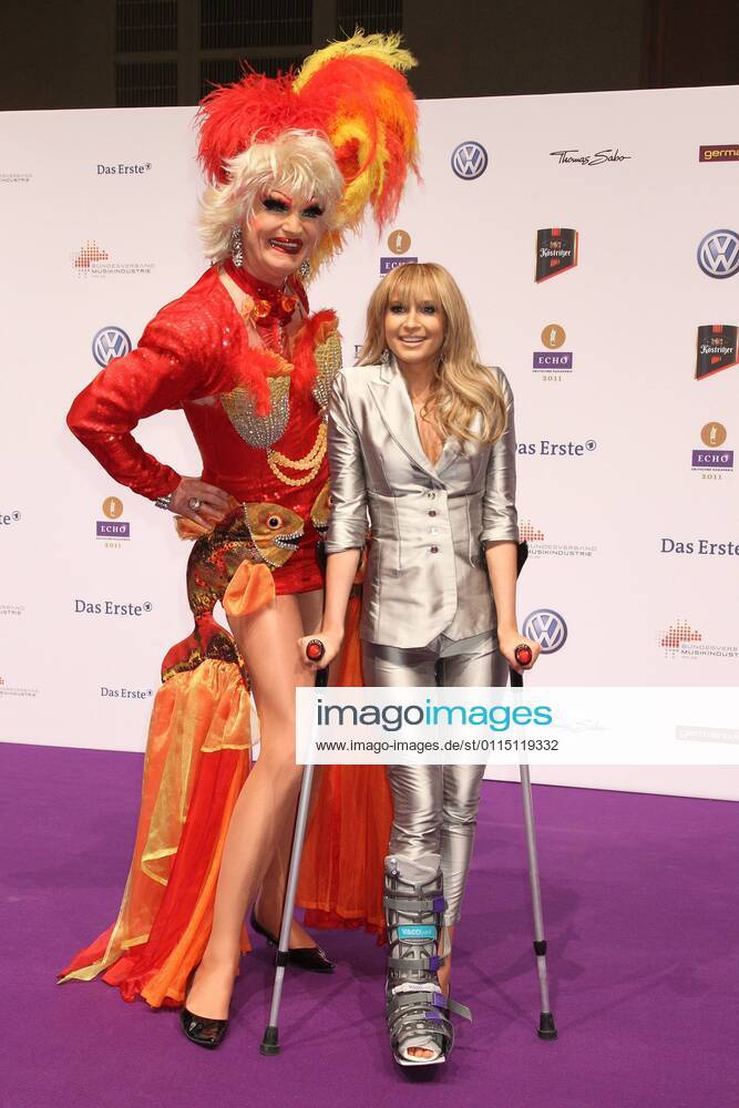 Mandy Grace Capristo Ex Monrose on Kruecken and Olivia Jones at the Echo 2011 the German Music Award at the Red Carpet in the Messe Berlin am Funkturm It is the 20 Echo 20 years Echo