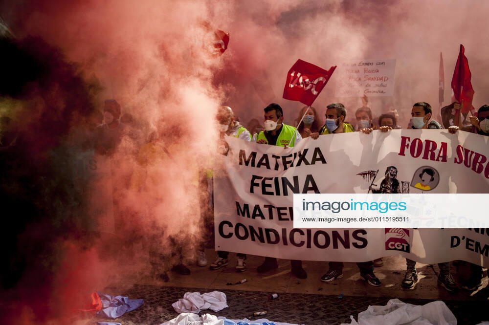 Healthcare workers protest amid smoke as they gather in Barcelona to demand an improvement in their working conditions aggravated by the coronavirus pandemic. Barcelona Spain - ZUMAb137 20210310_zap_b137_003
