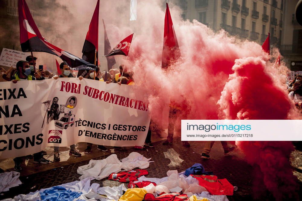 Healthcare workers protest amid smoke as they gather in Barcelona to demand an improvement in their working conditions aggravated by the coronavirus pandemic. Barcelona Spain - ZUMAb137 20210310_zap_b137_007