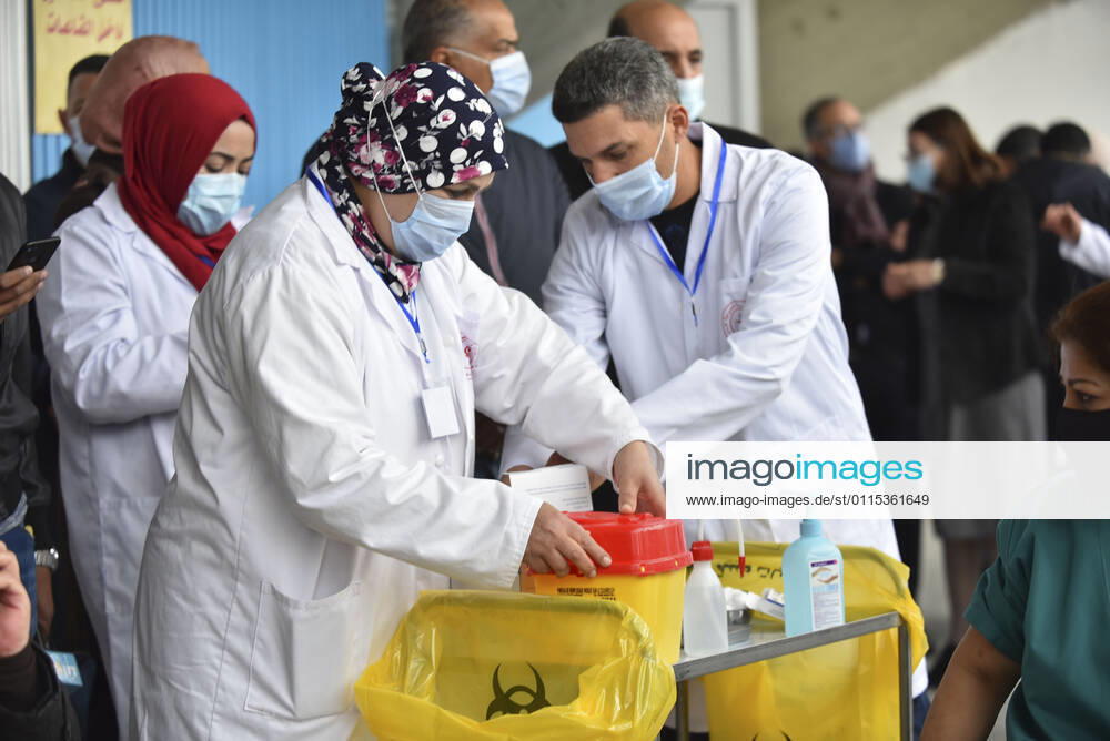 A healthcare personnel receives the first dose of the Sputnik V coronavirus (COVID-19) vaccine at a sahra hospital established in El Menzah Sports Palace as vaccination process begins in Tunis, Tunisia on March 13, 2021. NEWS : Debut du processus de vaccination a Tunis - 13 03 2021 WassimJdidi Panoramic