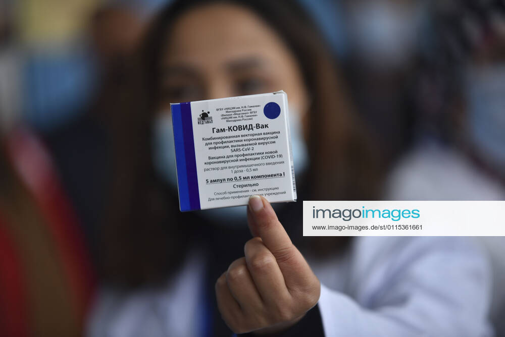 A healthcare personnel receives the first dose of the Sputnik V coronavirus (COVID-19) vaccine at a sahra hospital established in El Menzah Sports Palace as vaccination process begins in Tunis, Tunisia on March 13, 2021. NEWS : Debut du processus de vaccination a Tunis - 13 03 2021 WassimJdidi Panoramic