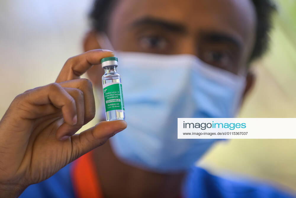 (210313) -- ADDIS ABABA, March 13, 2021 -- A medical worker shows a vial of the COVID-19 vaccine in Addis Ababa, Ethiopia, on March 13, 2021. Ethiopian State Minister of Health Dereje Duguma disclosed on Saturday that the east African country plans to give COVID-19 vaccine jabs to 20 percent of its population by March 2022. Duguma disclosed the plan during a ceremony in Addis Ababa to officially start COVID-19 vaccine jabs in the country. ) ETHIOPIA-ADDIS ABABA-COVID-19 VACCINATION-START MichaelxTewelde