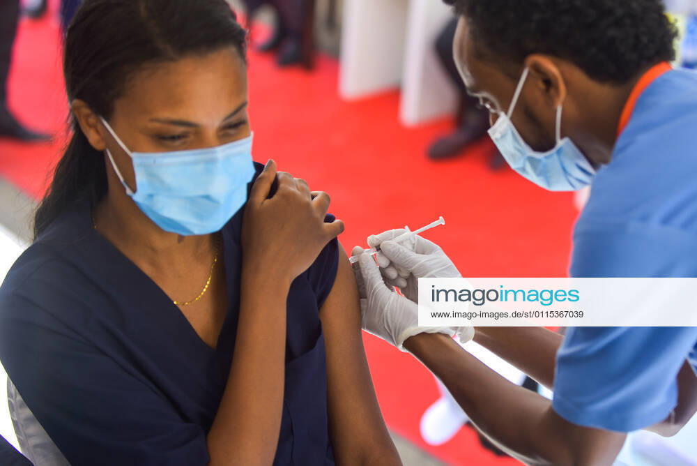 (210313) -- ADDIS ABABA, March 13, 2021 -- A woman receives the COVID-19 vaccine in Addis Ababa, Ethiopia, on March 13, 2021. Ethiopian State Minister of Health Dereje Duguma disclosed on Saturday that the east African country plans to give COVID-19 vaccine jabs to 20 percent of its population by March 2022. Duguma disclosed the plan during a ceremony in Addis Ababa to officially start COVID-19 vaccine jabs in the country. ) ETHIOPIA-ADDIS ABABA-COVID-19 VACCINATION-START MichaelxTewelde