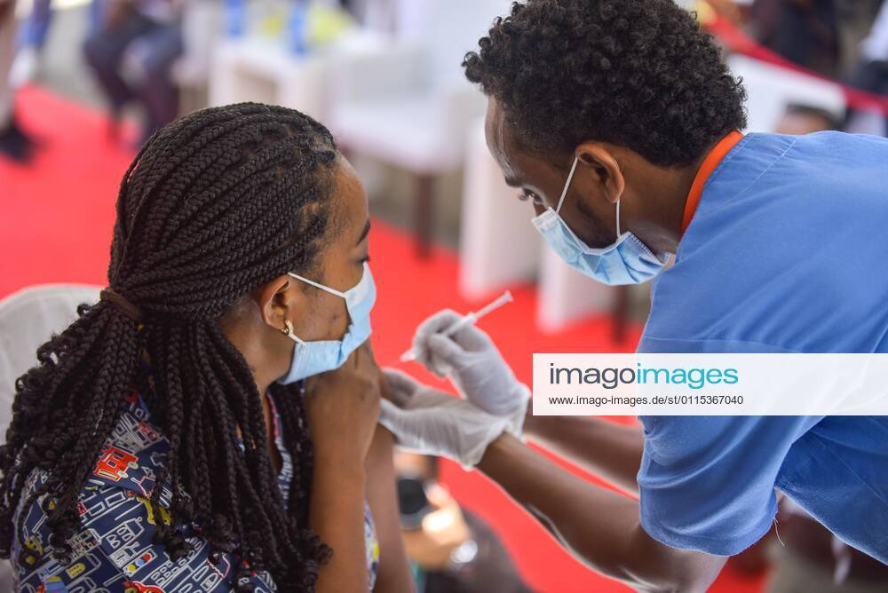 (210313) -- ADDIS ABABA, March 13, 2021 -- A woman receives the COVID-19 vaccine in Addis Ababa, Ethiopia, on March 13, 2021. Ethiopian State Minister of Health Dereje Duguma disclosed on Saturday that the east African country plans to give COVID-19 vaccine jabs to 20 percent of its population by March 2022. Duguma disclosed the plan during a ceremony in Addis Ababa to officially start COVID-19 vaccine jabs in the country. ) ETHIOPIA-ADDIS ABABA-COVID-19 VACCINATION-START MichaelxTewelde
