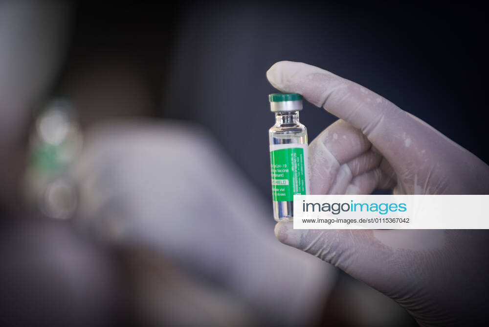 (210313) -- ADDIS ABABA, March 13, 2021 -- A medical worker shows a vial of the COVID-19 vaccine in Addis Ababa, Ethiopia, on March 13, 2021. Ethiopian State Minister of Health Dereje Duguma disclosed on Saturday that the east African country plans to give COVID-19 vaccine jabs to 20 percent of its population by March 2022. Duguma disclosed the plan during a ceremony in Addis Ababa to officially start COVID-19 vaccine jabs in the country. ) ETHIOPIA-ADDIS ABABA-COVID-19 VACCINATION-START MichaelxTewelde