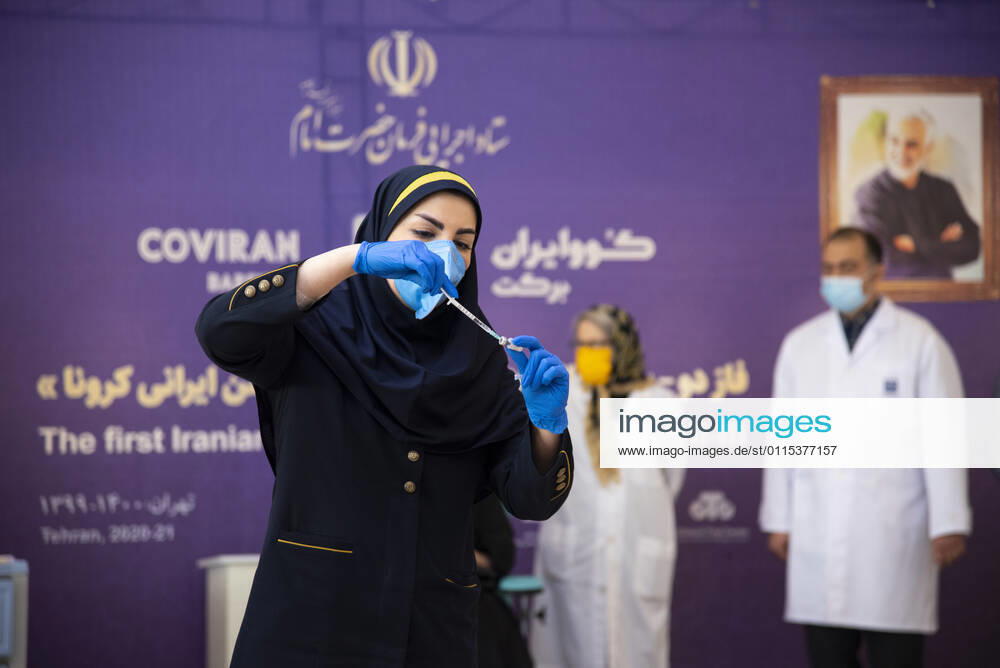 Iran: COVID-19 vaccine starts clinical trial An Iranian medical Staff, fills the syringe with Barakat Iranian COVID-19 vaccine Tehran Tehran Iran