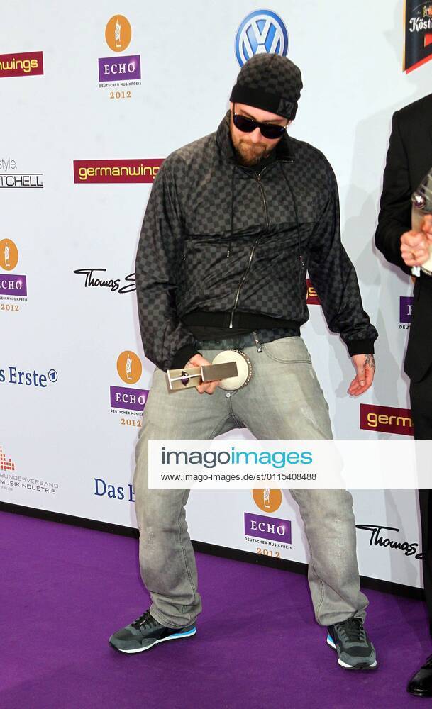 Award winner Sido with Echo award in a unique pose at the Echo 2012 the German Music Award Award winner before the ceremony at the Messe Berlin
