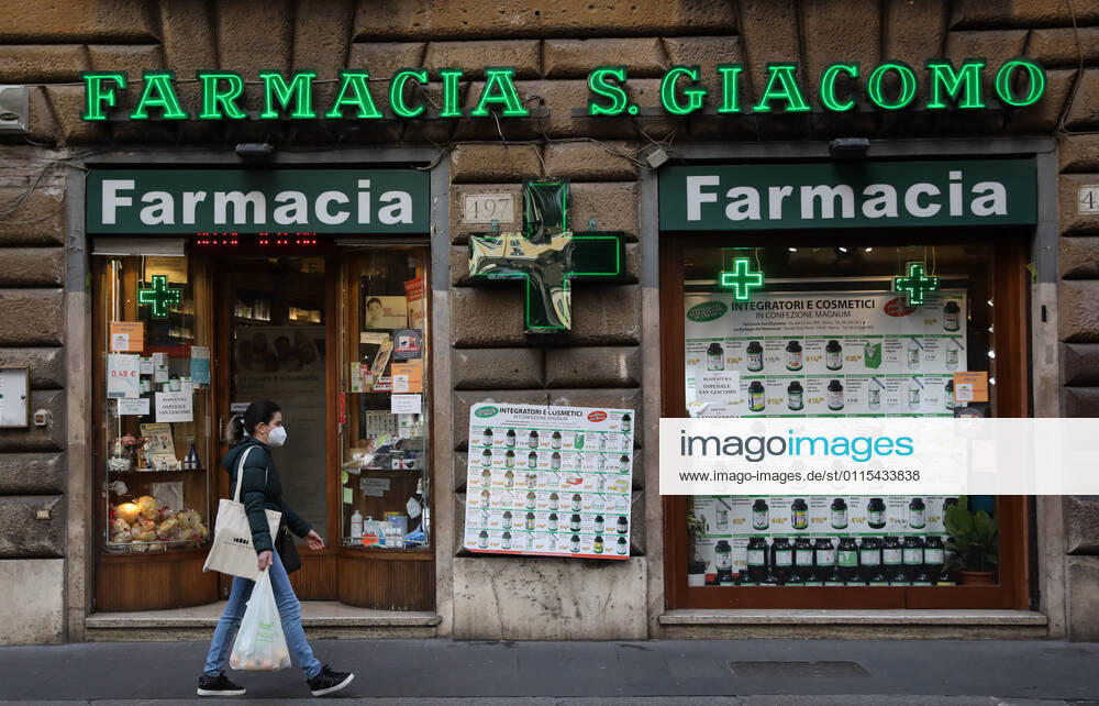 (210316) -- ROME, March 16, 2021 -- A woman wearing a face mask walks past a pharmacy on Via del Corso in Rome, Italy, March 15, 2021. Italy entered into a new period of semi-lockdown on Monday, with over half of its 20 regions falling into the red zone and subject to the maximum level of restrictions. ) ITALY-ROME-COVID-19-SEMI-LOCKDOWN ChengxTingting