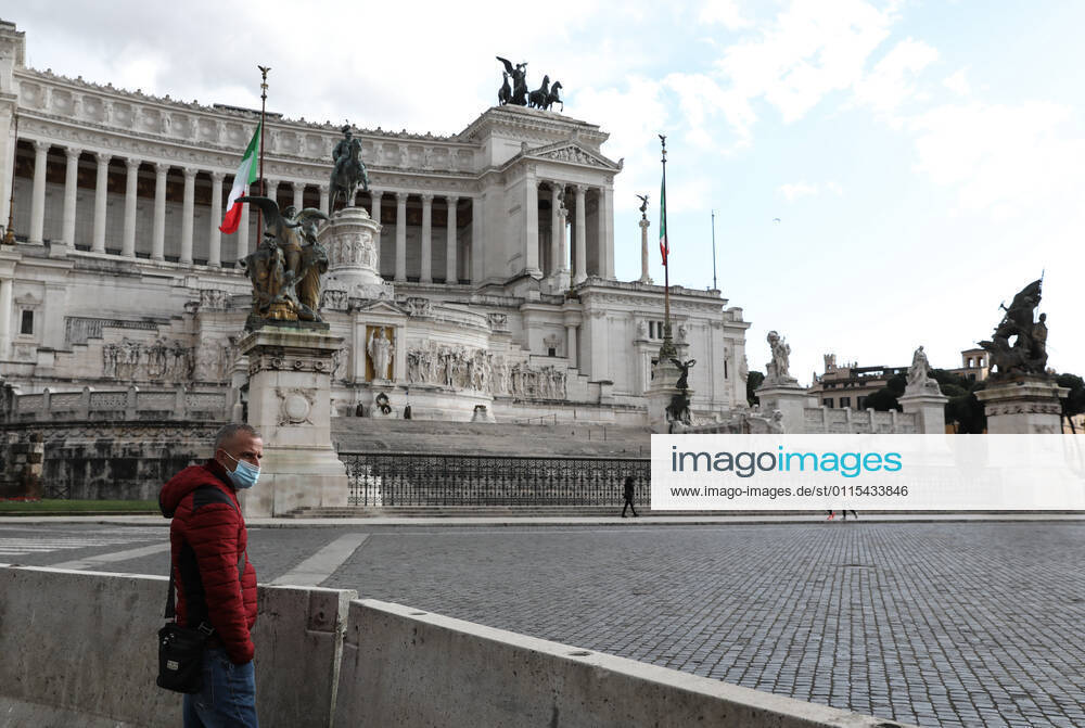 (210316) -- ROME, March 16, 2021 -- A man wearing a face mask stands at the Piazza Venezia in Rome, Italy, March 15, 2021. Italy entered into a new period of semi-lockdown on Monday, with over half of its 20 regions falling into the red zone and subject to the maximum level of restrictions. ) ITALY-ROME-COVID-19-SEMI-LOCKDOWN ChengxTingting