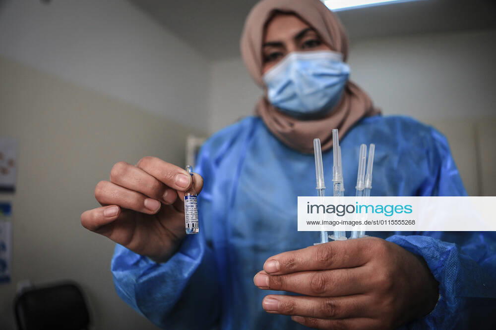 A shot of the Sputnik V Covid-19 vaccine is prepared to be administered at the Ministry of Health Sabha Al Harazeen clinic, in Al Shejaeiya neighborhood, in the east of Gaza City, 17 March 2021. The Palestinian Authority received on 17 March around 60,000 coronavirus vaccine doses as a first shipment through the COVAX initiative. People start to receive doses of Russia s Sputnik V COVID-19 coronavirus vaccine in the Ministry of Health clinics and United Nations Relief and Works Agency for Palestine Refugees (UNRWA) s clinics. Gaza City Palestine - ZUMAq100 20210317_zaa_q100_004