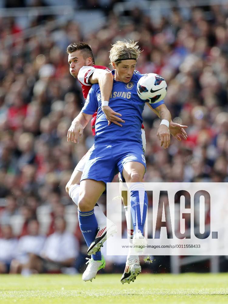 Arsenal s Carl Jenkinson tussles with Chelsea s Fernando Torres..Football - Barclays Premier League - Arsenal v Chelsea - Emirates Stadium - 29 9 12 ..Mandatory Credit: David Klein Sportimage... No use with unauthorized audio, video, data, fixture lists, club league logos or ?live? services. Online in-match use limited to 45 images, no video emulation. No use in betting, games or single club league player publications. Please contact your account representative for further details.... .