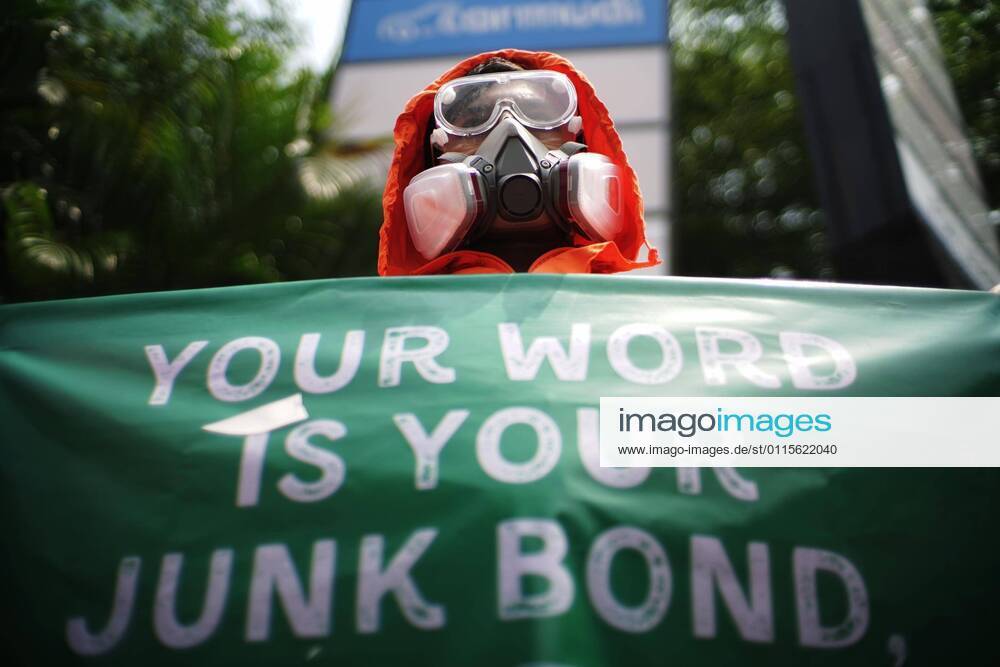 A number of environmental activists who participated in the pause for climate action using complete Personal Protective Equipment held a rally in front of the Standard Cahartered tower, Jakarta, Friday (3 19 2021). In action they called on governments and industry leaders to take responsibility and jointly take concrete action in climate rescue, one of which is to stop funding the deadly fossil fuel industry. Jakarta Indonesia - ZUMAz107 20210319_zip_z107_011