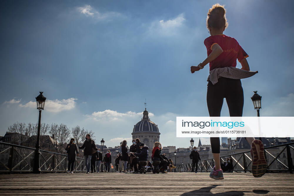 (210320) -- PARIS, March 20, 2021 -- People are seen on the Pont des Arts bridge in Paris, France, on March 20, 2021. French Prime Minister Jean Castex on Thursday announced new massive measures to curb COVID-19 in the country s 16 worst-hit regions, including Paris. Starting Friday midnight, about 18 million French people in regions such as Paris, Hauts-de-France in the north as well as the Alpes-Maritimes on the Mediterranean should stay at home, Castex announced at a press briefing on the epidemic situation. (Photo by Xinhua) FRANCE-PARIS-COVID-19-PARTIAL LOCKDOWN AurelienxMorissard