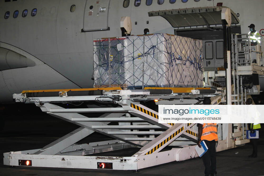 (210322) -- COTONOU, March 22, 2021 -- Workers unload a batch of COVID-19 vaccines developed by the Chinese pharmaceutical company Sinovac at Cardinal Bernadin Gantin International Airport in Cotonou, Benin, March 21, 2021. A batch of coronavirus vaccine developed by the Chinese pharmaceutical company Sinovac arrived in Cotonou, the economic capital of Benin, on Sunday evening. (Photo by Xinhua) BENIN-COTONOU-CHINESE VACCINE-ARRIVAL SeraphinxZounyekpe