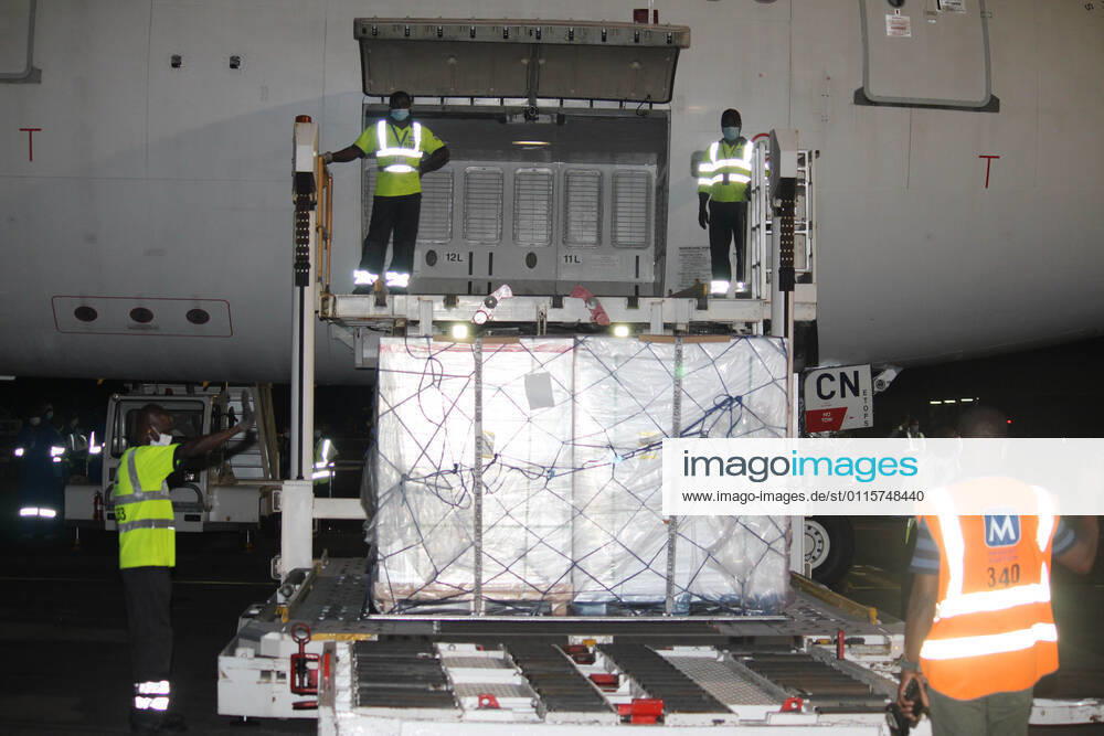 (210322) -- COTONOU, March 22, 2021 -- Workers unload a batch of COVID-19 vaccines developed by the Chinese pharmaceutical company Sinovac at Cardinal Bernadin Gantin International Airport in Cotonou, Benin, March 21, 2021. A batch of coronavirus vaccine developed by the Chinese pharmaceutical company Sinovac arrived in Cotonou, the economic capital of Benin, on Sunday evening. (Photo by Xinhua) BENIN-COTONOU-CHINESE VACCINE-ARRIVAL SeraphinxZounyekpe