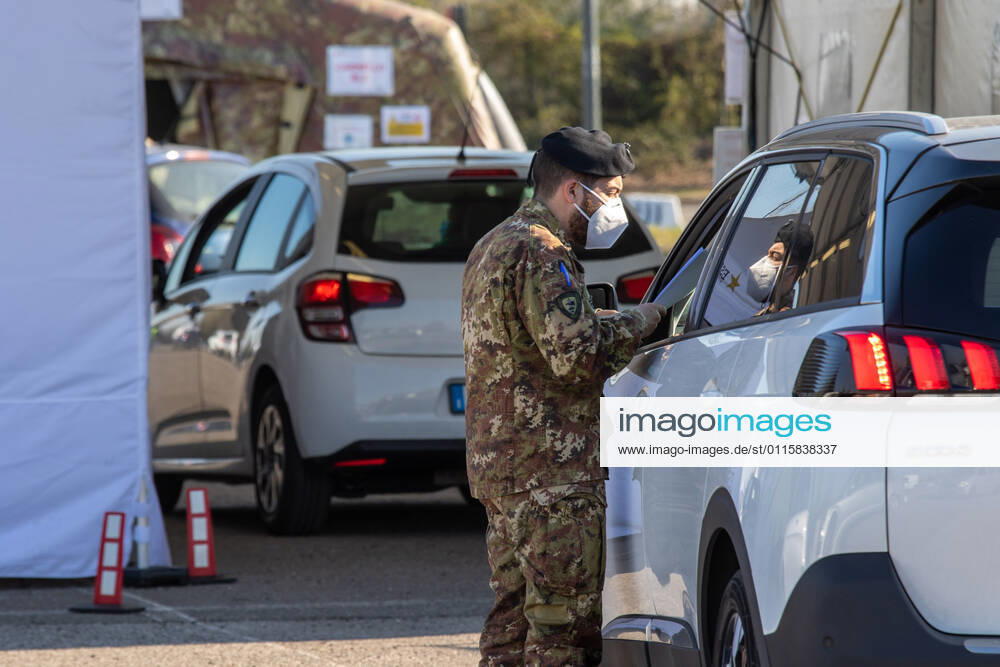 Milan, people queuing in cars for anti Covid vaccines at the drive-thru point in via Novara managed by the army Editorial Usage Only