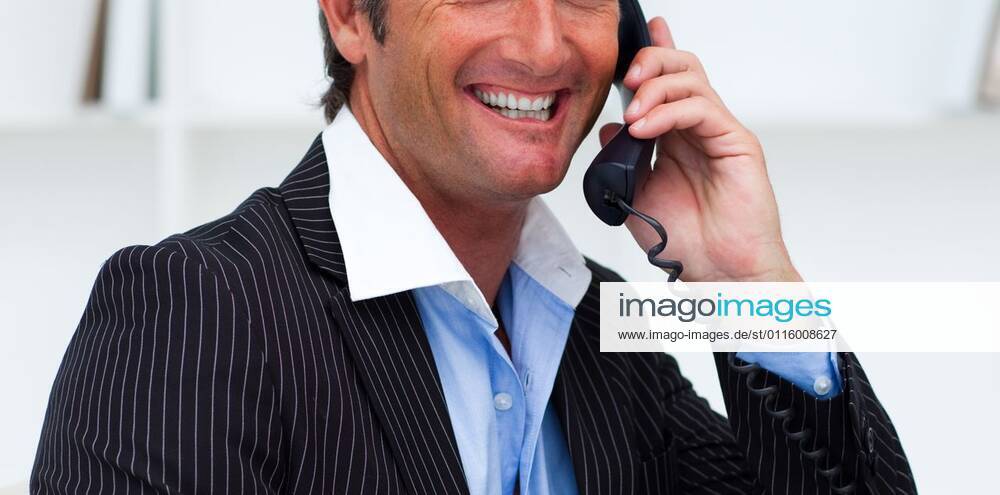 Close up of a smiling businessman talking on phone Close up of a smiling businessman talking on phone in the office, model released, Cape Town, South Africa, 2009-10-03T23:00:00.000Z, 17249.jpg, background, business, businessman, call, cell, collar, communicate, communication, computer, concept, confident, conversation, corporate, desk, executive, expression, face, hand, handsome, holding, mobile, modern, office, part of, phone, power, professional, service, shirt, smiling, speaking, studio, success, suit, support, talking, team, telephone, tie, white, work, worker 30s, Mid Adult, Man, Male, Caucasian, Caucasian Appearance, 35-39 Years, Mid Adult Men