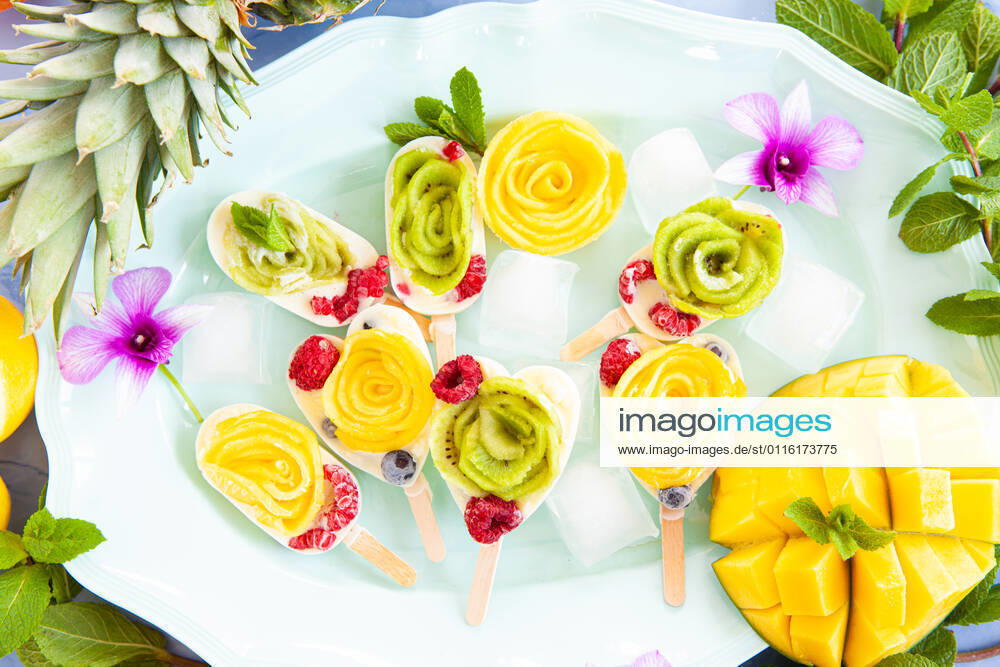 Homemade popsicles with fruit and coconut milk 1079706552