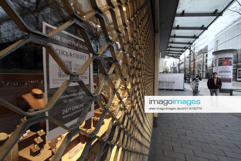 Sticker with inscription Click Collect sticks to a closed jeweler in the city center of Mannheim, Baden Württemberg, Germany