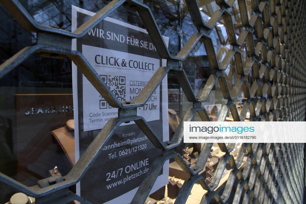 Sticker with inscription Click Collect sticks to a closed jeweler in the city center of Mannheim, Baden Württemberg, Germany