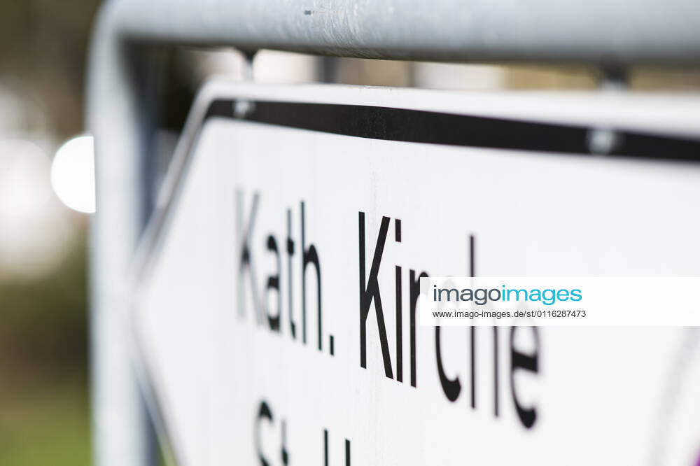 Feature Religion The way to a Catholic church is signposted Photo Kirchner Media Wedel Lotte North Rhine Westphalia Germany