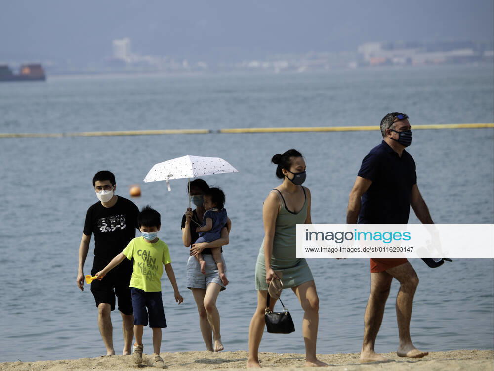 Beach reopen in Hong Kong under COVID-19 pandemic Hong Kong, China, Apr 02: Beach goers wear surgical mask play at the Gold Coast Beach in Hong Kong. Hong Kong China 6449_236306