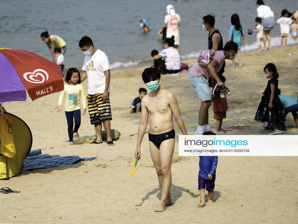 Beach reopen in Hong Kong under COVID-19 pandemic Hong Kong, China, Apr 02: Beach goers wear surgical mask play at the Gold Coast Beach in Hong Kong. Hong Kong China 6449_236313