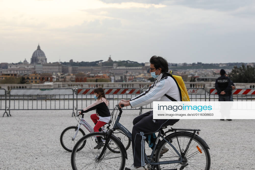 (210404) -- ROME, April 4, 2021 -- People ride bicycles at the closed Terrazza del Pincio in Rome, Italy, April 3, 2021. Italy is spending Easter in lockdown after the government made the whole nation a COVID-19 red zone from Saturday to Easter Monday. ) ITALY-ROME-EASTER-LOCKDOWN ChengxTingting