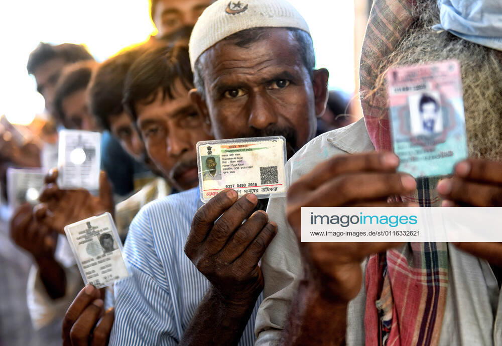 Voters hold National Identity Cards ready to cast their ballots during the 2021 West Bengal Legislative Assembly election in Baruipur. Baruipur India - ZUMAs197 20210406_zaa_s197_010