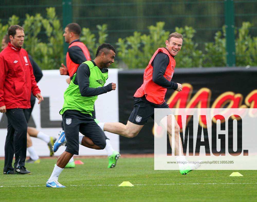 England s Wayne Rooney and Ashley Cole during training..England Training - London Colney- 11 10 12 - Picture David Klein Sportimage .