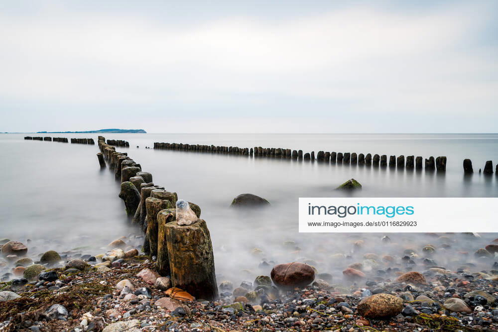 Buhne made of wooden piles at the baltic coast, long time exposure, Dranske, island Rügen