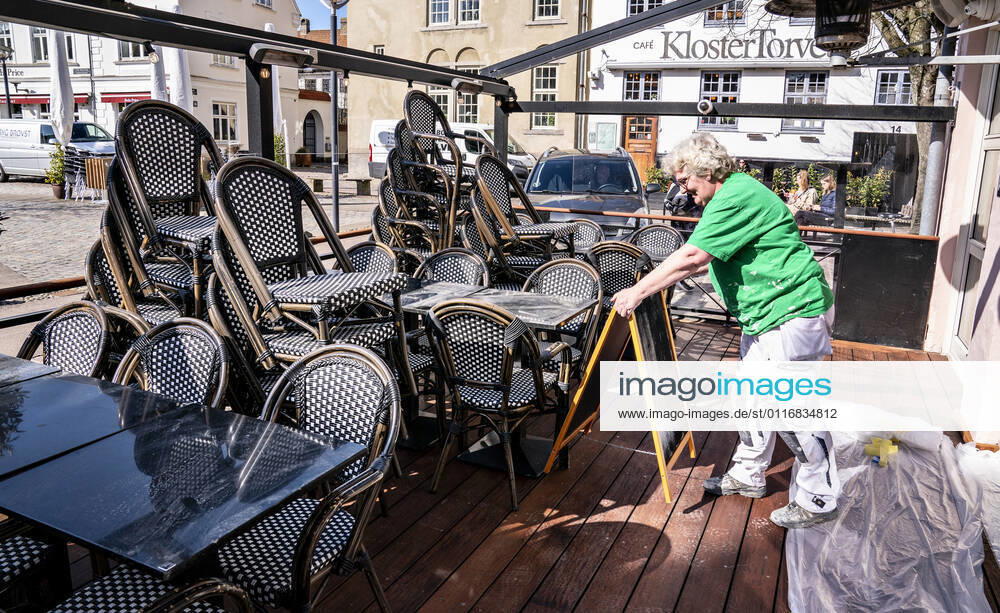 Chairs and tables are ready for outdoor dining at CW Obels Plads in Aalborg, 16 April 2021 Restaurants and cafés can once again welcome guests inside from 21 April Denmark is on its way to reopening further, and thus Danes can soon look forward to a more normal everyday life This is due to the agreement that all parliame
