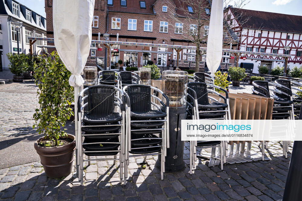 Chairs and tables are ready for outdoor dining at CW Obels Plads in Aalborg, 16 April 2021 Restaurants and cafés can once again welcome guests inside from 21 April Denmark is on its way to reopening further, and thus Danes can soon look forward to a more normal everyday life This is due to the agreement that all parliame