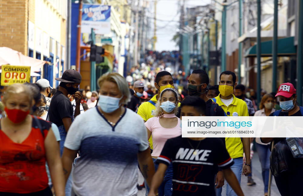 April 16, 2021. Venezuelans wearing face masks as a preventive measure against covid, walk along the busy Comercio boulevard in the city of Valencia, Carabobo state. Photo: Valencia Venezuela - ZUMAhe3_ 20210416_zbp_he3_007