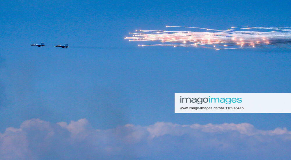 CRIMEA, RUSSIA – APRIL 22, 2021: Sukhoi Su-30SM fighter aircraft create thermal noise during an exercise by various branches of the Russian Armed Forces at the Opuk training ground. The exercise involves units of Russian combined-arms army, large units of the Russian Air Force and Air Defence Force, as well as warships, ships, and coastal defence units of the Black Sea Fleet, part of the Caspian Flotilla and units of the Russian Airborne Forces. Sergei Malgavko TASS TS0FDAE4